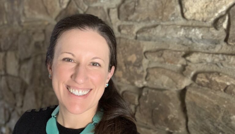 2.20.2022 black sweater headshot 2 Mary Apicella 768x437